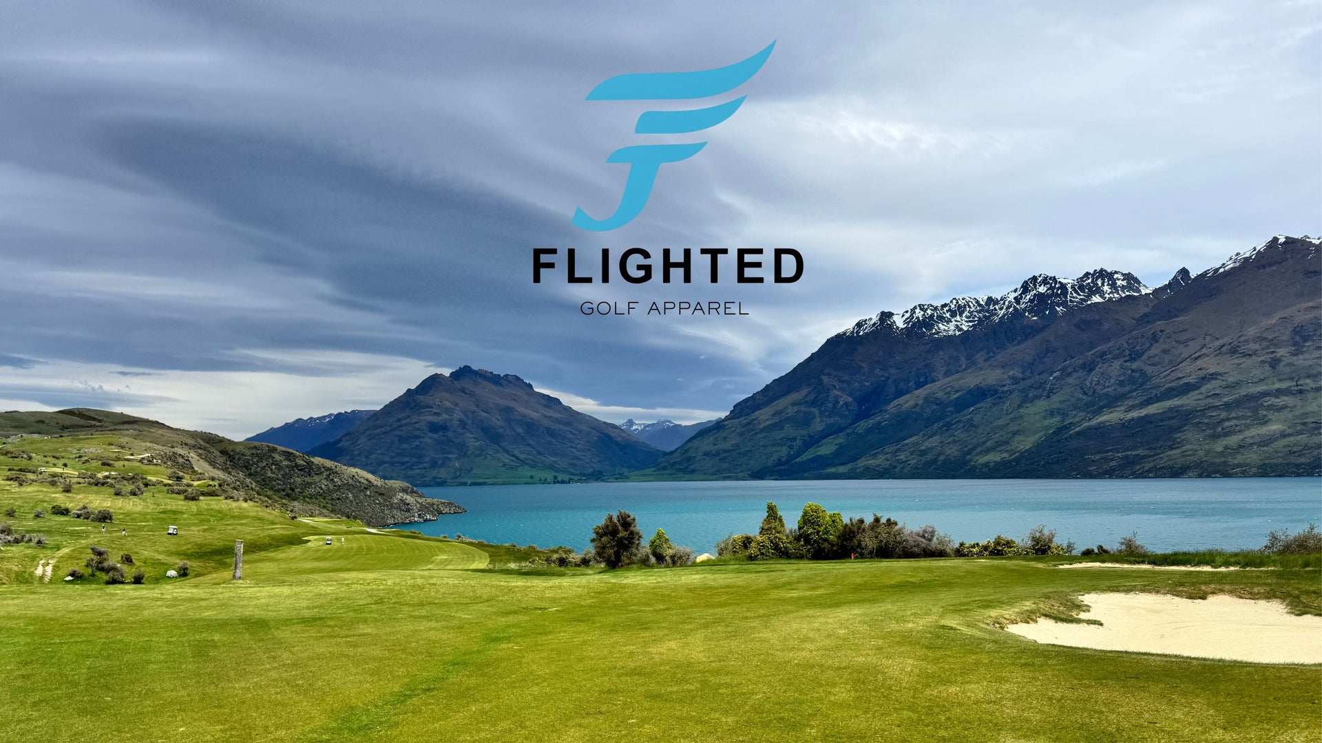 Golf course with mountains and lake in the background, featuring the Fligthed logo.